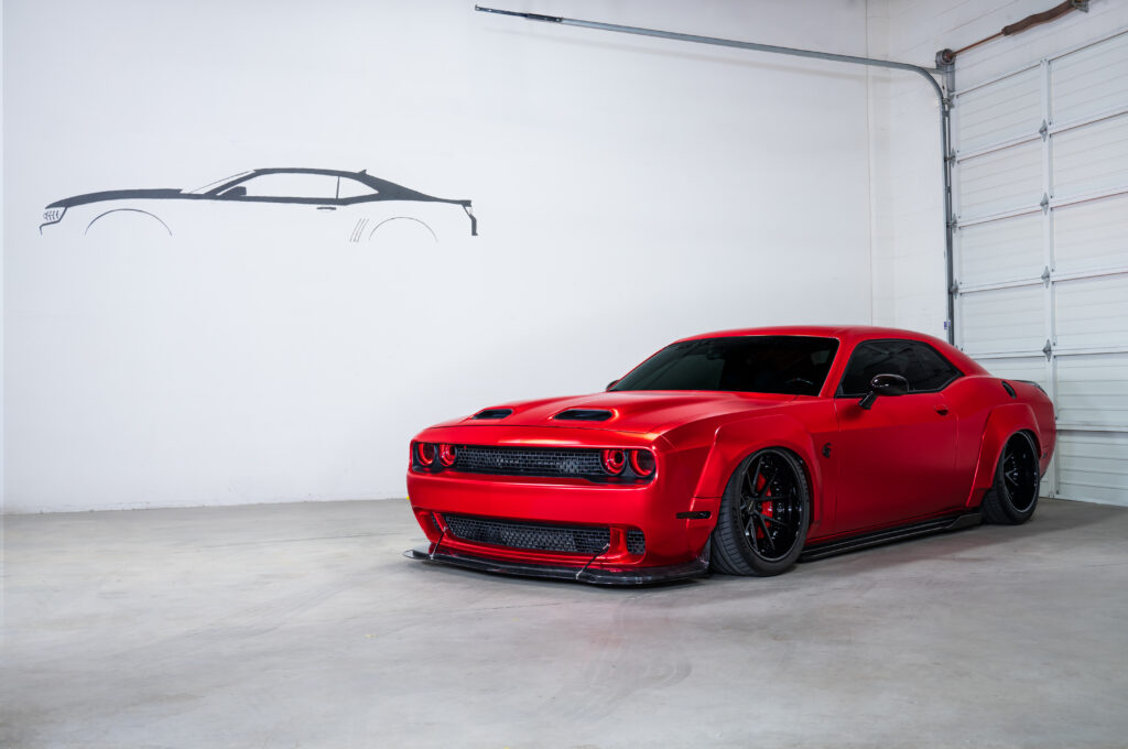 Dodge Challenger in red in Auto Obsessionz